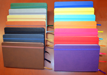 Assortment of colored faux leather journals